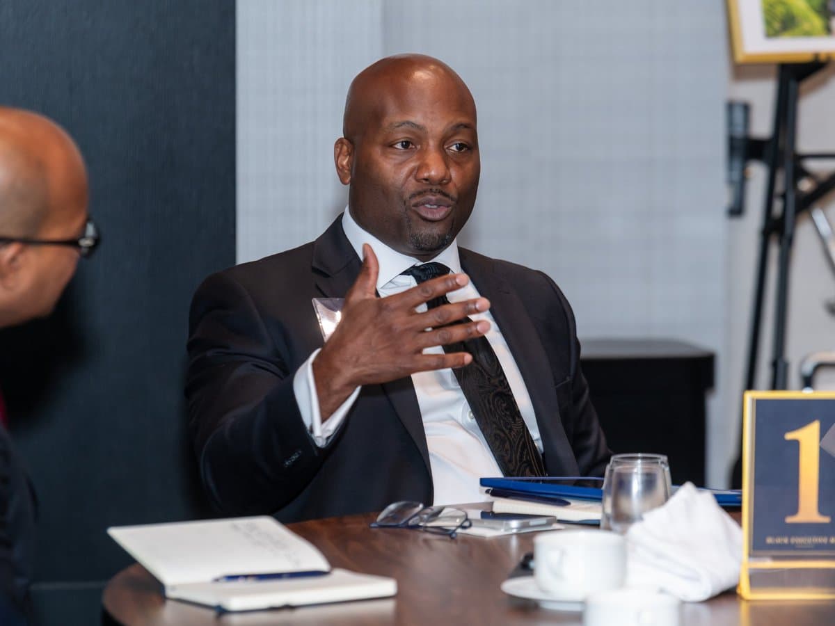 A member speaking at a BEM forum table